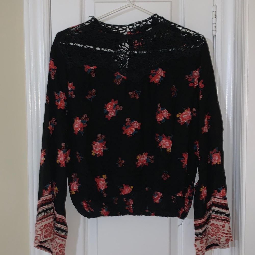 Floral blouse with bell sleeves.